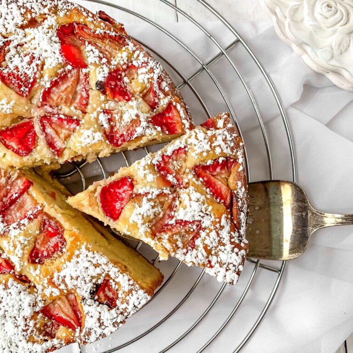 easy ricotta cake with strawberries slice being served