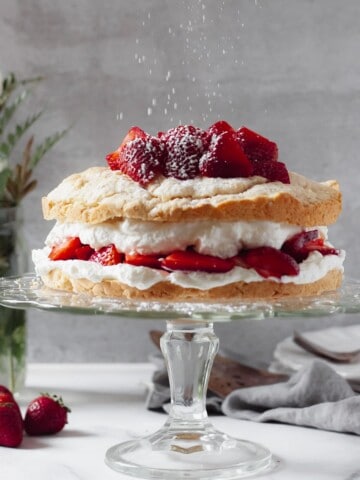 old fashioned strawberry shortcake from scratch full cake on a cake stand