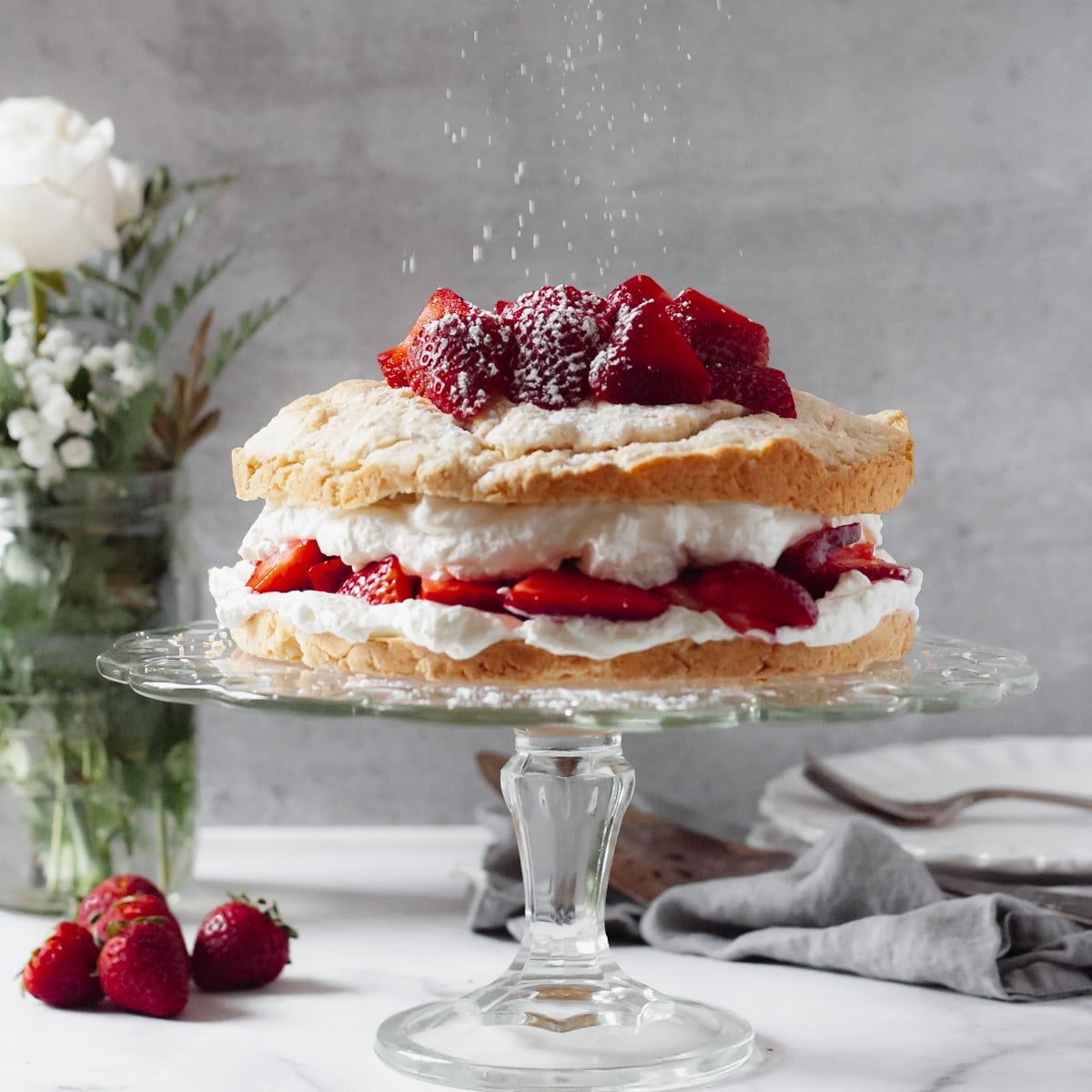 old fashioned strawberry shortcake from scratch full cake on a cake stand