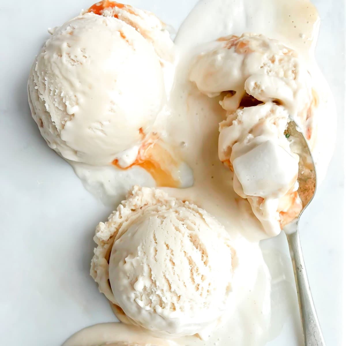 Philadelphia-style, homemade cereal milk ice cream scoops with a spoon