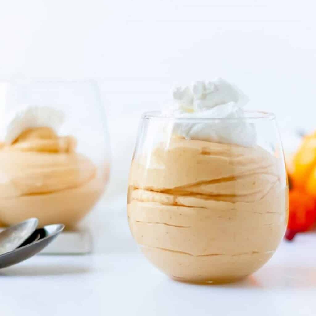 A serving cup of easy, 3 ingredient pumpkin mousse recipe.