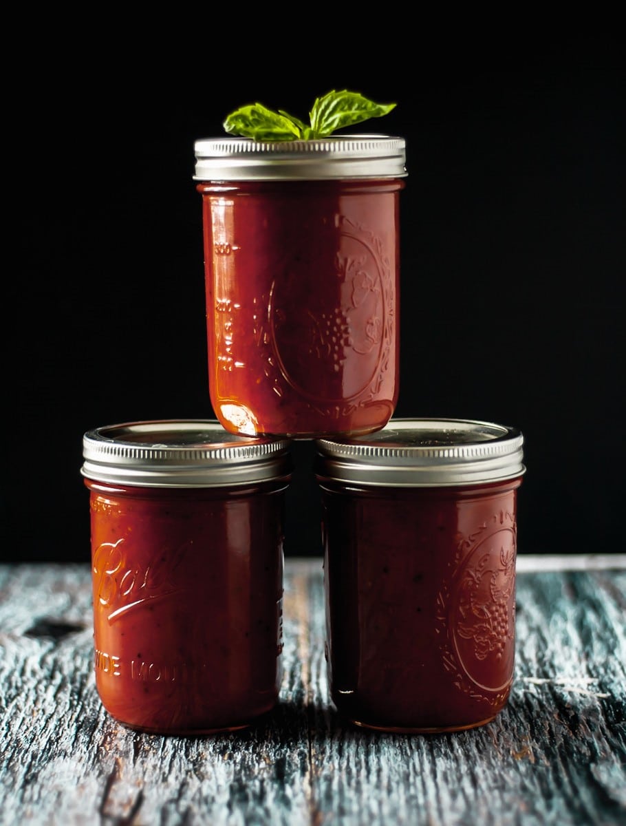 three jars of sugao Italian tomato sauce stacked on each other.