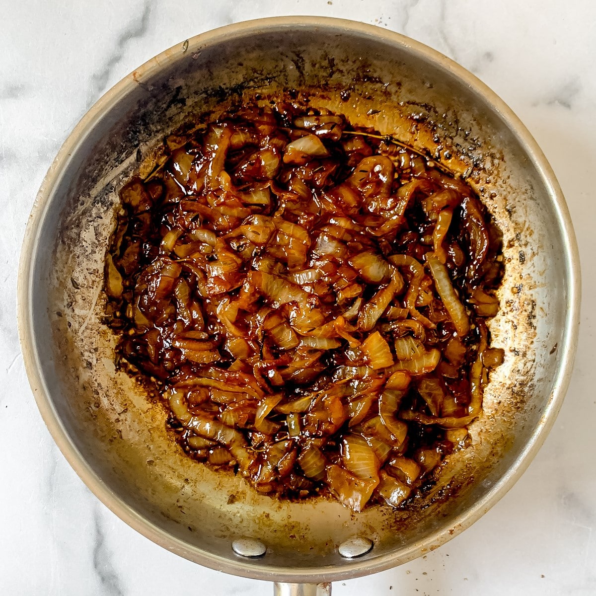Onions and balsamic vinegar in a saute pan.