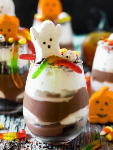 Halloween pudding cups with ghost marshmallows, pumpkin marshmallows and candy corn